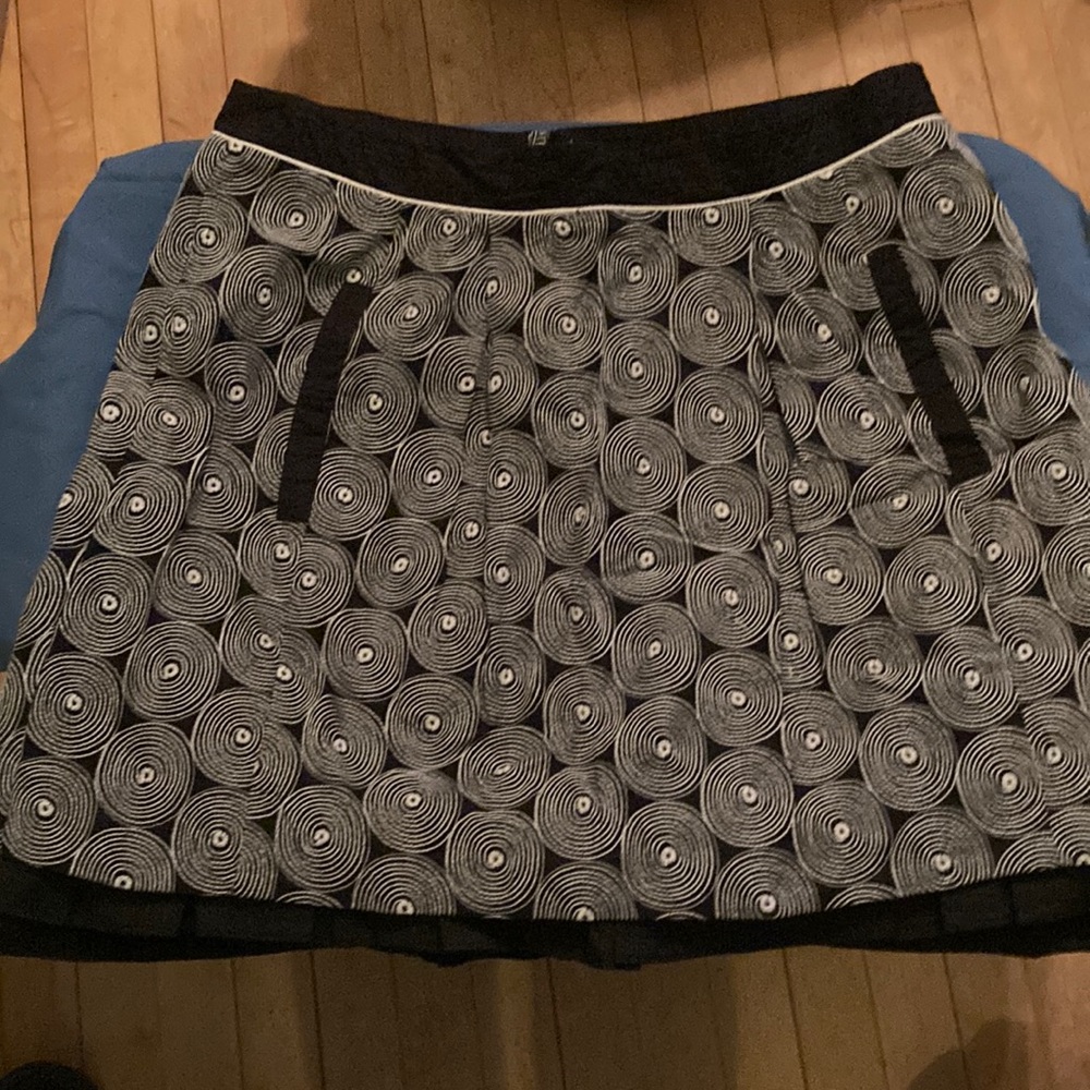 Anthropology skirt with black and white spirals. Tag says, “Floreat”